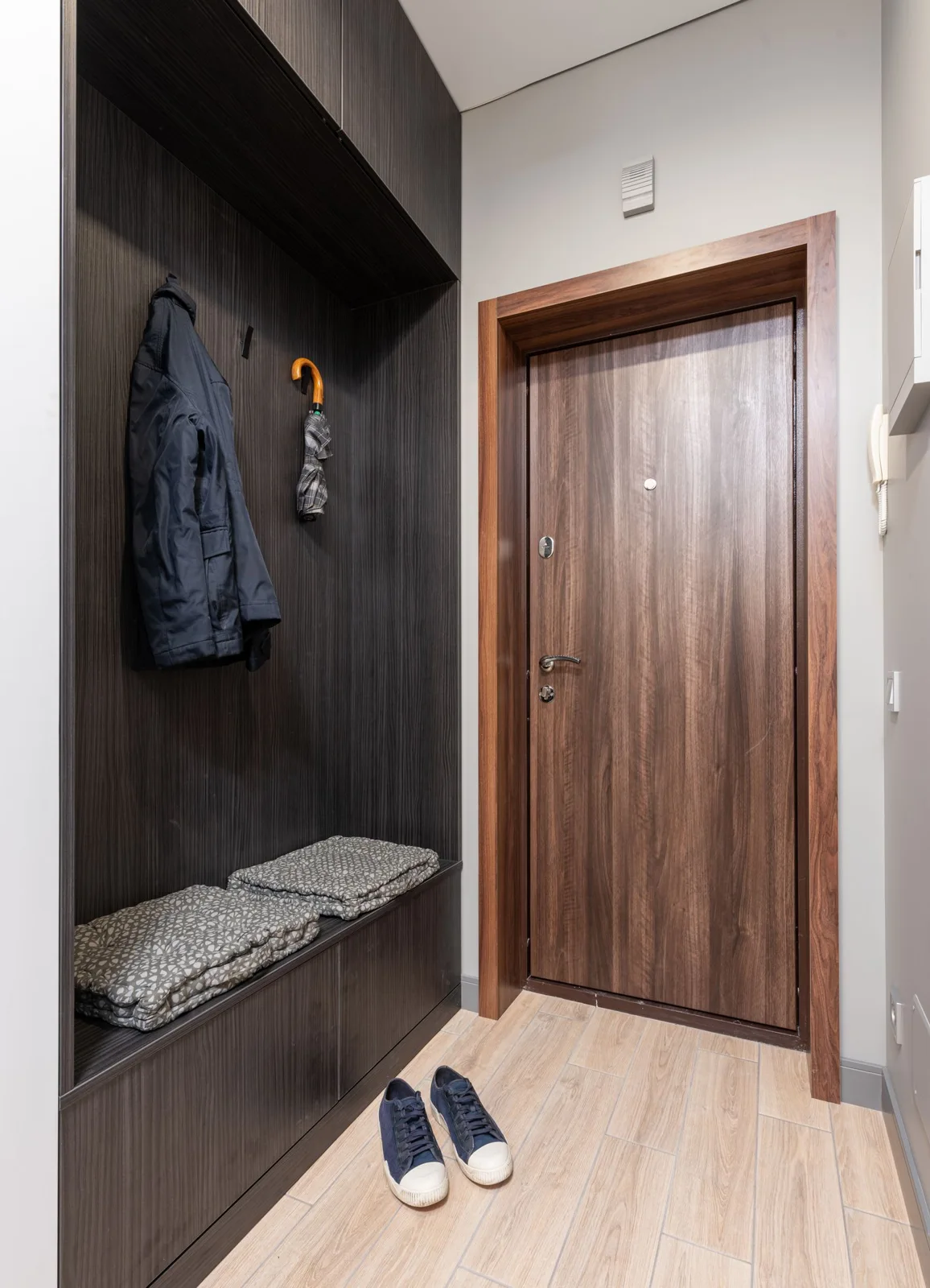 Entryway with wall hooks, bench and shoes