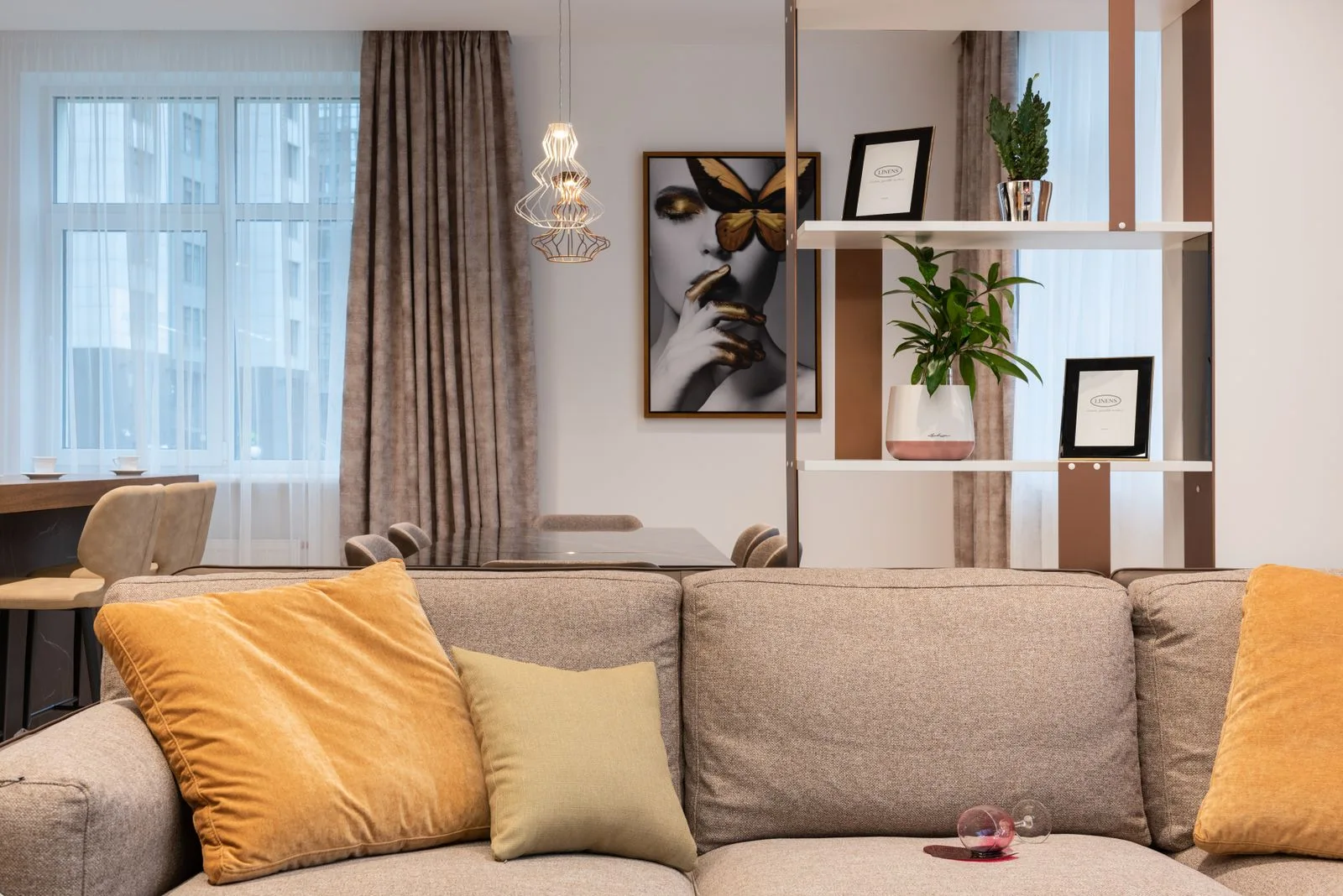 Living room with sofa, pillows and plants