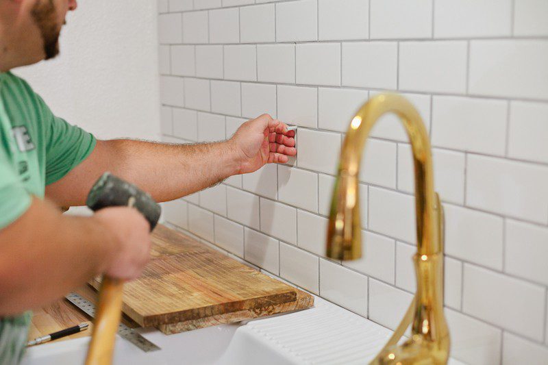 How to hang open shelving on tile (the easy way). A DIY step by step tutorial that you NEED to see before you get started featured by popular Florida lifestyle blogger Fresh Mommy Blog