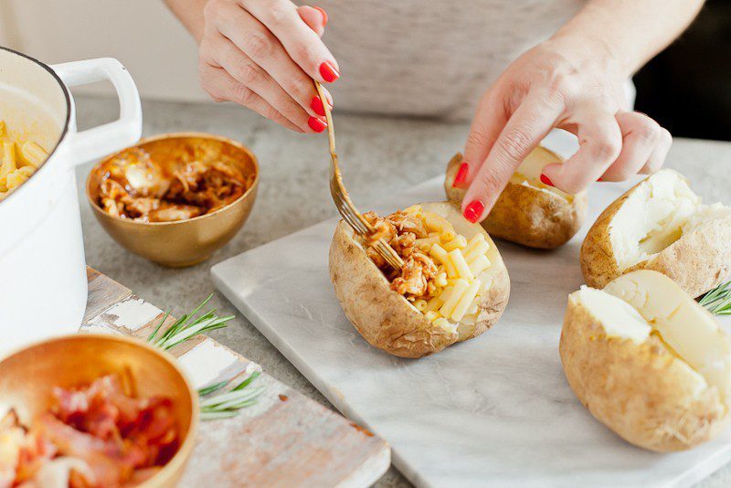 Mac and Cheese Stuffed Baked Potato. Top with BBQ chicken or bacon for a delicious twist on a classic meal.