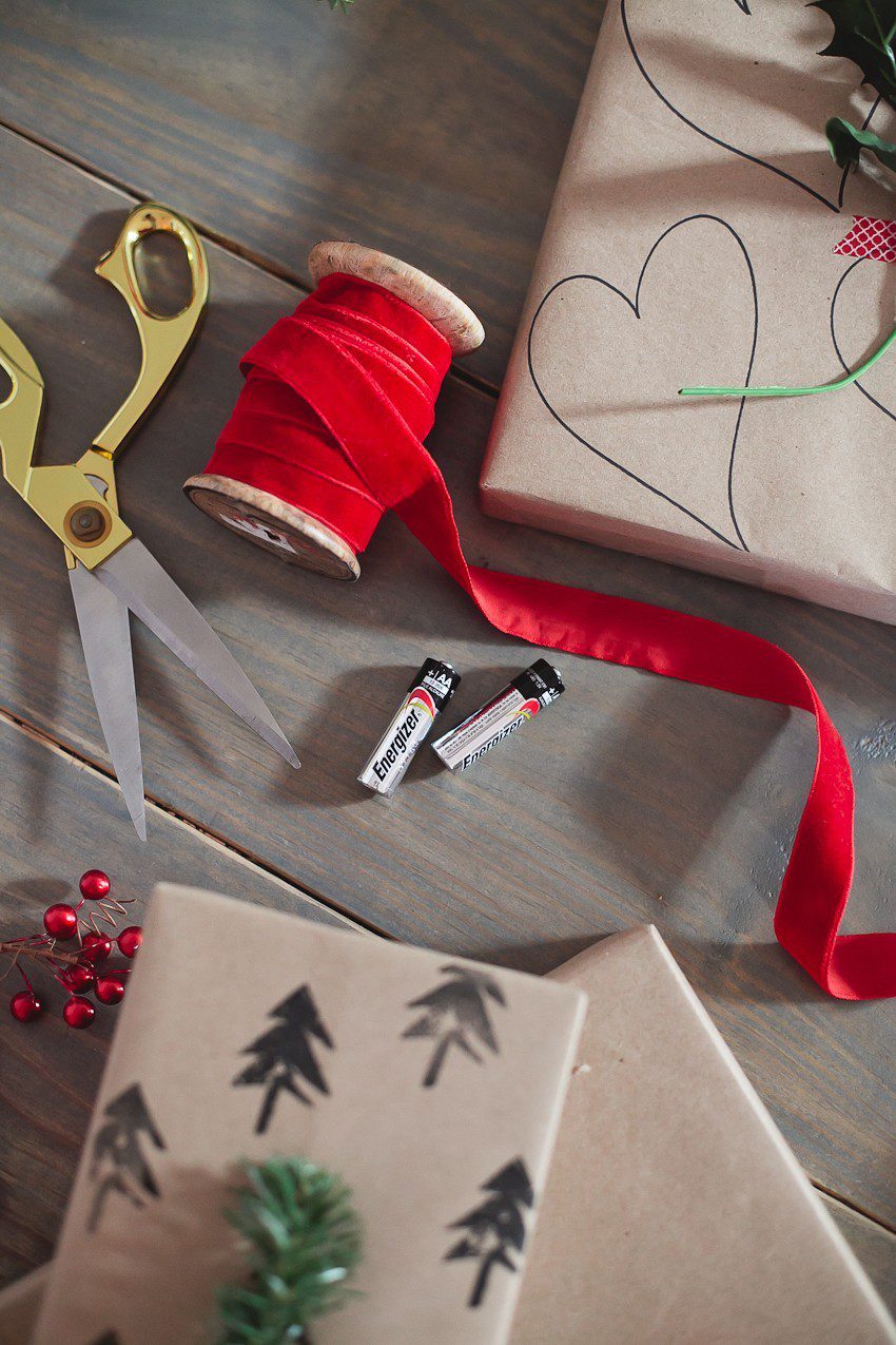 Save time and money with this easy and simple Christmas gift wrap hack! Gift wrapping ideas you can't miss, like using a potato to stamp your customized design.  | The Simple and Easy Christmas Gift Wrapping Ideas You Can't Miss feeatured by top Florida life and style blog Fresh Mommy Blog