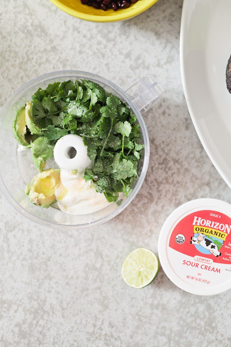 Loaded Sweet Potato Mexican Street Fries with Avocado Lime Dressing! A skinny and delicious twist on a loaded fry platter that won't mess with your waistline or derail your resolutions! Need a dinner to drool over? Try these Loaded Sweet Potato Mexican Street Fries! A skinny and delicious twist on a loaded fry platter that won't mess with your waistline or derail your resolutions! A healthy and hearty recipe from Tabitha Blue of Fresh Mommy Blog with Horizon.