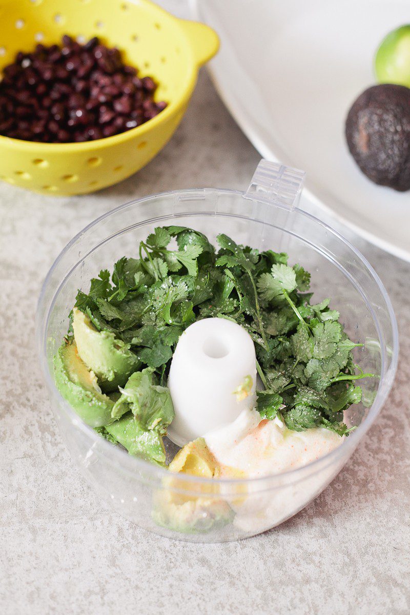 Loaded Sweet Potato Mexican Street Fries with Avocado Lime Dressing! A skinny and delicious twist on a loaded fry platter that won't mess with your waistline or derail your resolutions! Need a dinner to drool over? Try these Loaded Sweet Potato Mexican Street Fries! A skinny and delicious twist on a loaded fry platter that won't mess with your waistline or derail your resolutions! A healthy and hearty recipe from Tabitha Blue of Fresh Mommy Blog with Horizon.