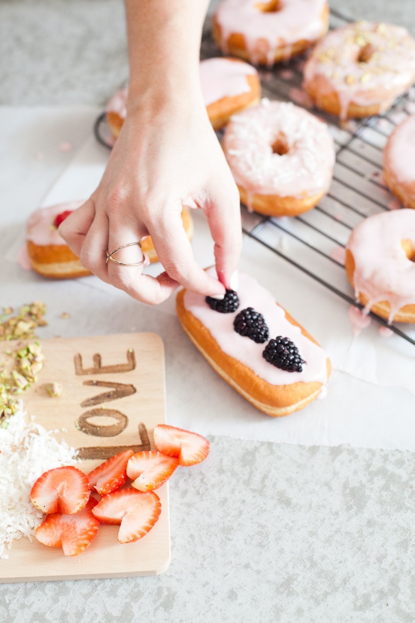 There's definitely no right or wrong way to celebrate with donuts, whether it be a special occasion or a normal day you want to delight in. Invite some friends over or bring out your toppings and let the family have at it to sweeten the deal! Let everyone frost their own DIY pretty in pink donuts and compare toppings before indulging that sweet tooth with every bite!