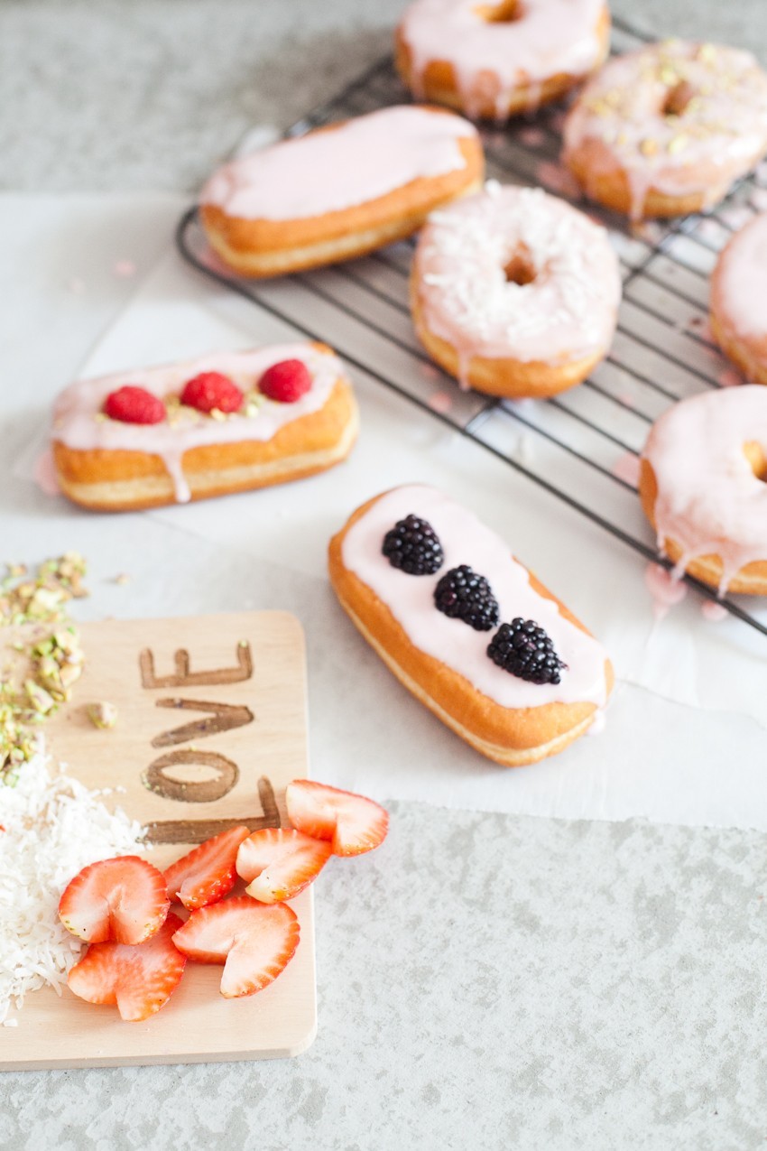 There's definitely no right or wrong way to celebrate with donuts, whether it be a special occasion or a normal day you want to delight in. Invite some friends over or bring out your toppings and let the family have at it to sweeten the deal! Let everyone frost their own DIY pretty in pink donuts and compare toppings before indulging that sweet tooth with every bite!