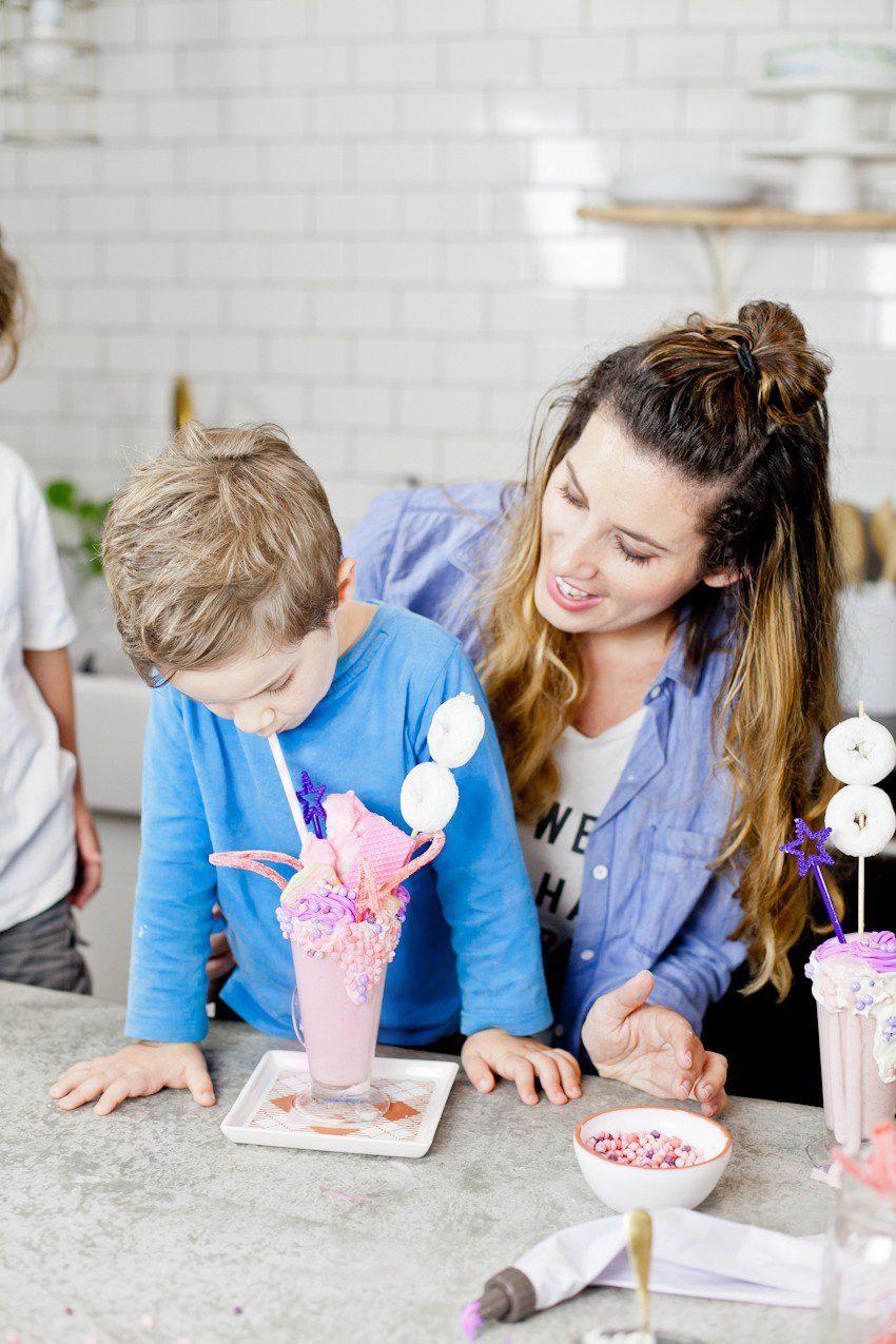 These Epic Royal Crazy shakes are indulgently MAGICAL! A rich, thick strawberry milkshake is topped with a sugaring of sprinkles and candies to make a delicious crazy shake drink fit for a princess... or a prince. A pretty in pink and purple freak shake!