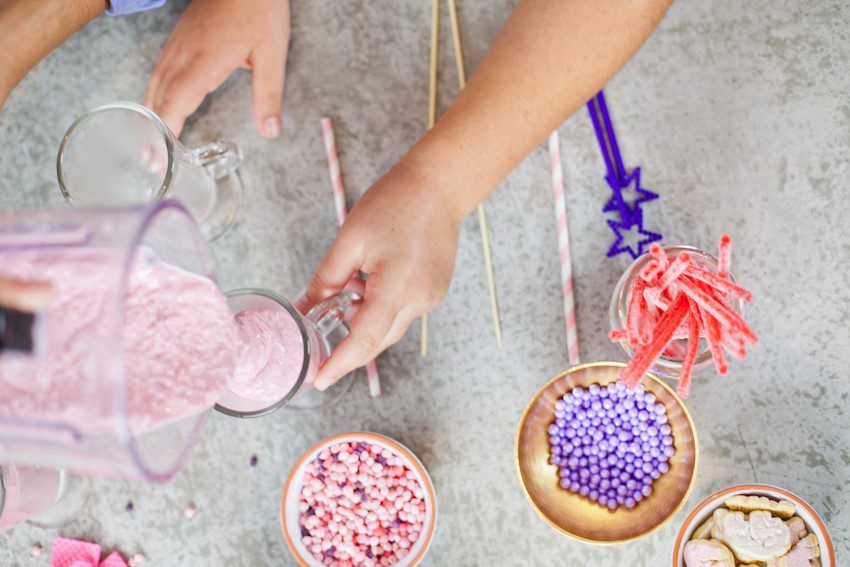These Epic Royal Crazy milkshakes are indulgently MAGICAL! A rich, thick strawberry milkshake is topped with a sugaring of sprinkles and candies to make a delicious drink fit for a princess... or a prince. A pretty in pink and purple freak shake!