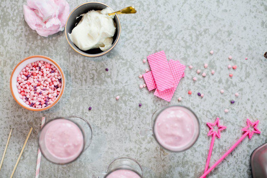 These Epic Royal Crazy milkshakes are indulgently MAGICAL! A rich, thick strawberry milkshake is topped with a sugaring of sprinkles and candies to make a delicious drink fit for a princess... or a prince. A pretty in pink and purple freak shake!