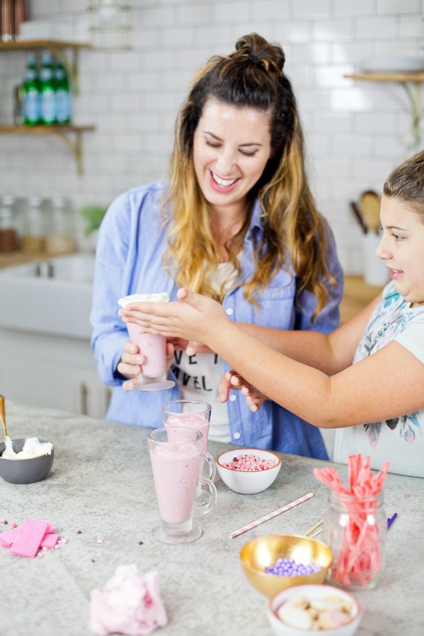 These Epic Royal Crazy milkshakes are indulgently MAGICAL! A rich, thick strawberry milkshake is topped with a sugaring of sprinkles and candies to make a delicious drink fit for a princess... or a prince. A pretty in pink and purple freak shake!