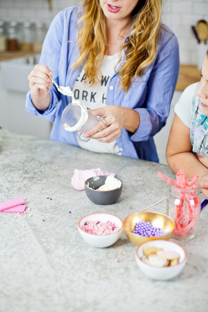 These Epic Royal Crazy milkshakes are indulgently MAGICAL! A rich, thick strawberry milkshake is topped with a sugaring of sprinkles and candies to make a delicious drink fit for a princess... or a prince. A pretty in pink and purple freak shake!