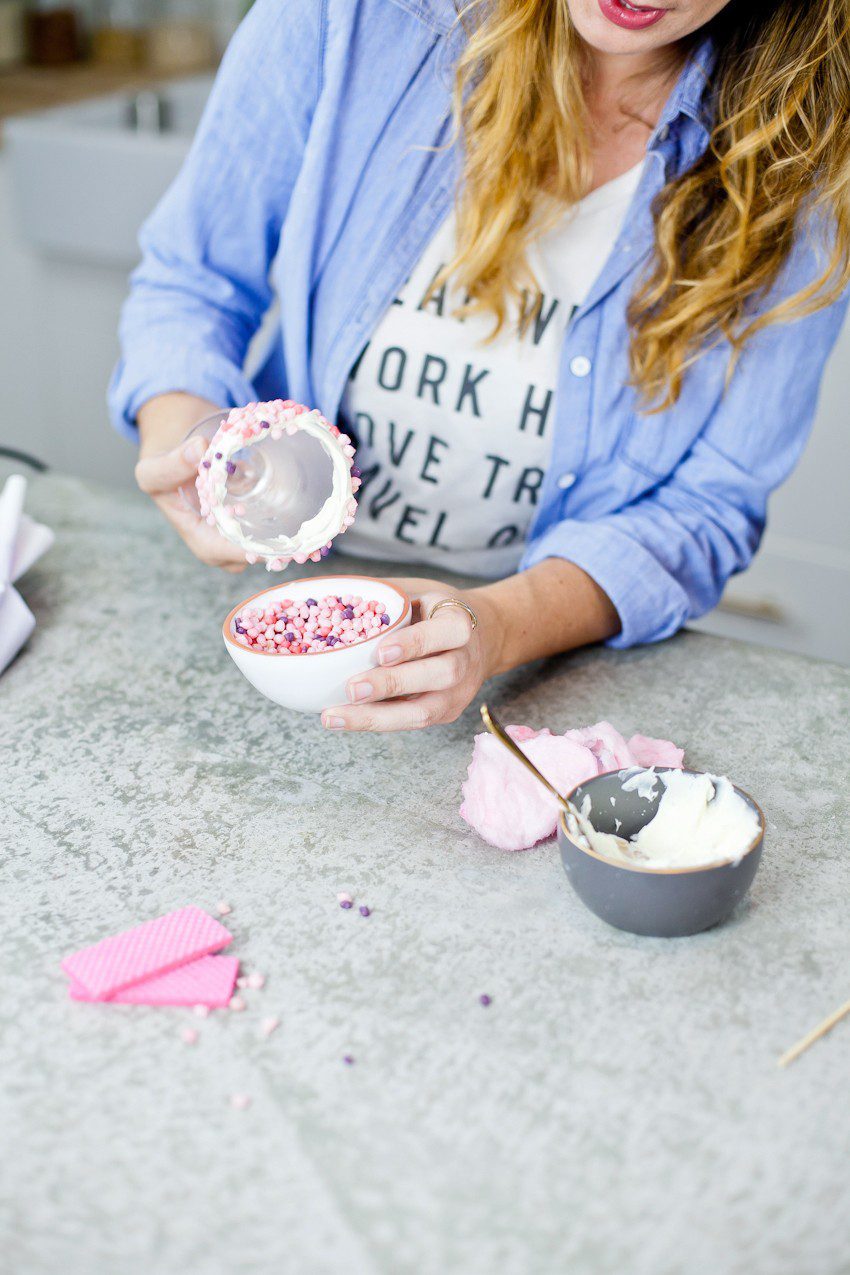 These Epic Royal Crazy milkshakes are indulgently MAGICAL! A rich, thick strawberry milkshake is topped with a sugaring of sprinkles and candies to make a delicious drink fit for a princess... or a prince. A pretty in pink and purple freak shake!