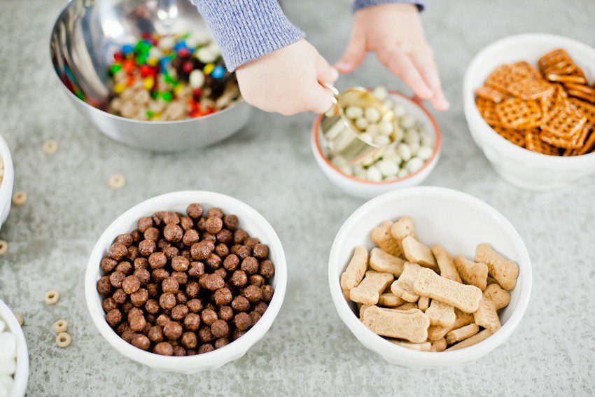 Kid Friendly Trail Mix Puppy Chow Activity and Snack! The kids will love this fun way to build and create their own trail mix, even on a rainy day!