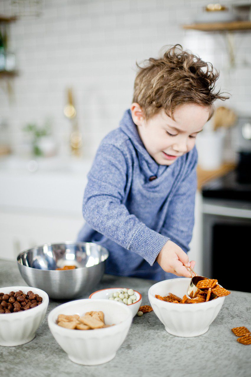 Kid Friendly Trail Mix Puppy Chow Activity and Snack! The kids will love this fun way to build and create their own trail mix, even on a rainy day!