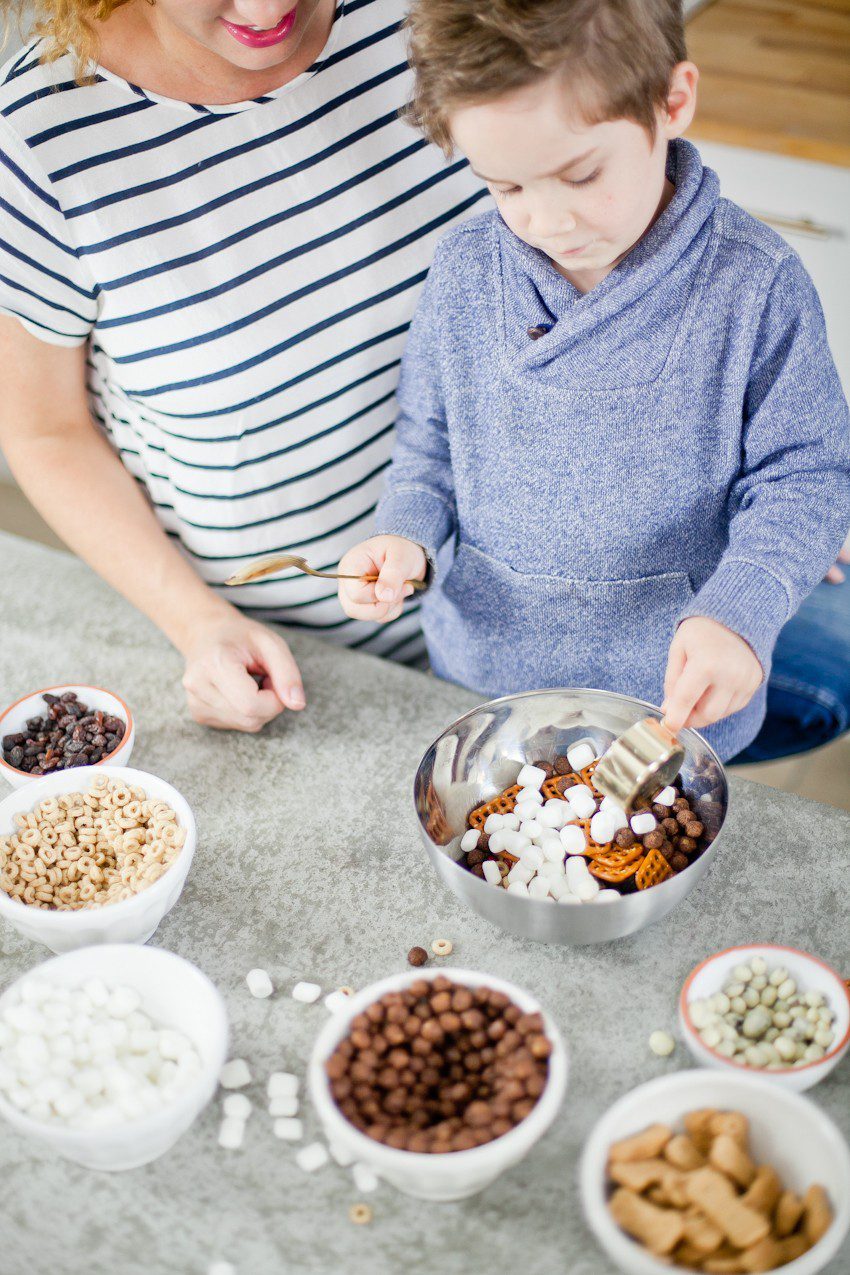 Kid Friendly Trail Mix Puppy Chow Activity and Snack! The kids will love this fun way to build and create their own trail mix, even on a rainy day!