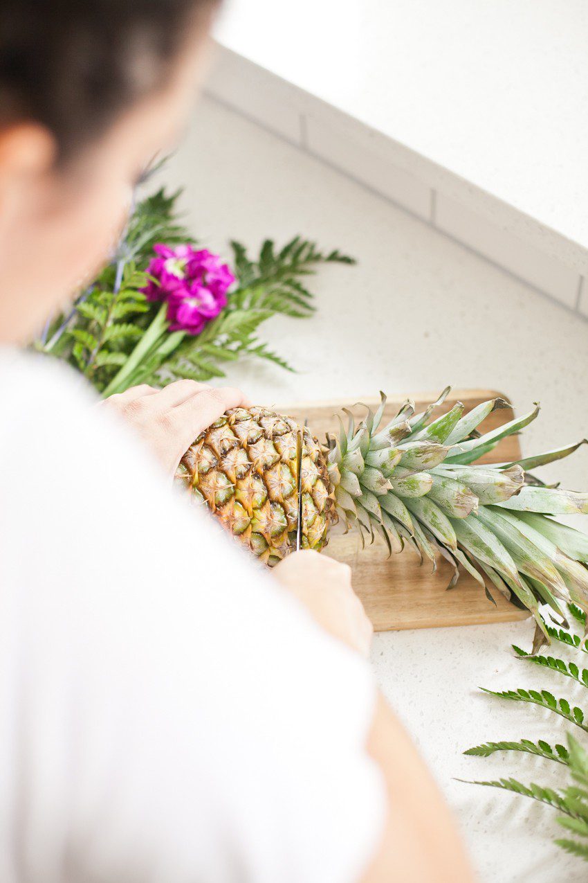 Pineapple Flower Arrangement for garden parties or a summer tropical fete! This DIY Pineapple vase is an easy to make centerpiece or perfect for a Tiki bar! - Tropical Pineapple Floral Arrangement featured by popular Florida lifestyle blogger Fresh Mommy Blog