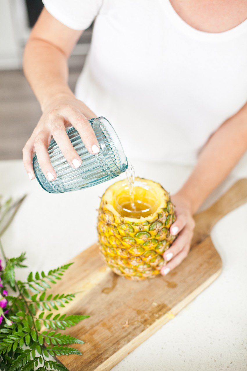 Pineapple Flower Arrangement for garden parties or a summer tropical fete! This DIY Pineapple vase is an easy to make centerpiece or perfect for a Tiki bar!