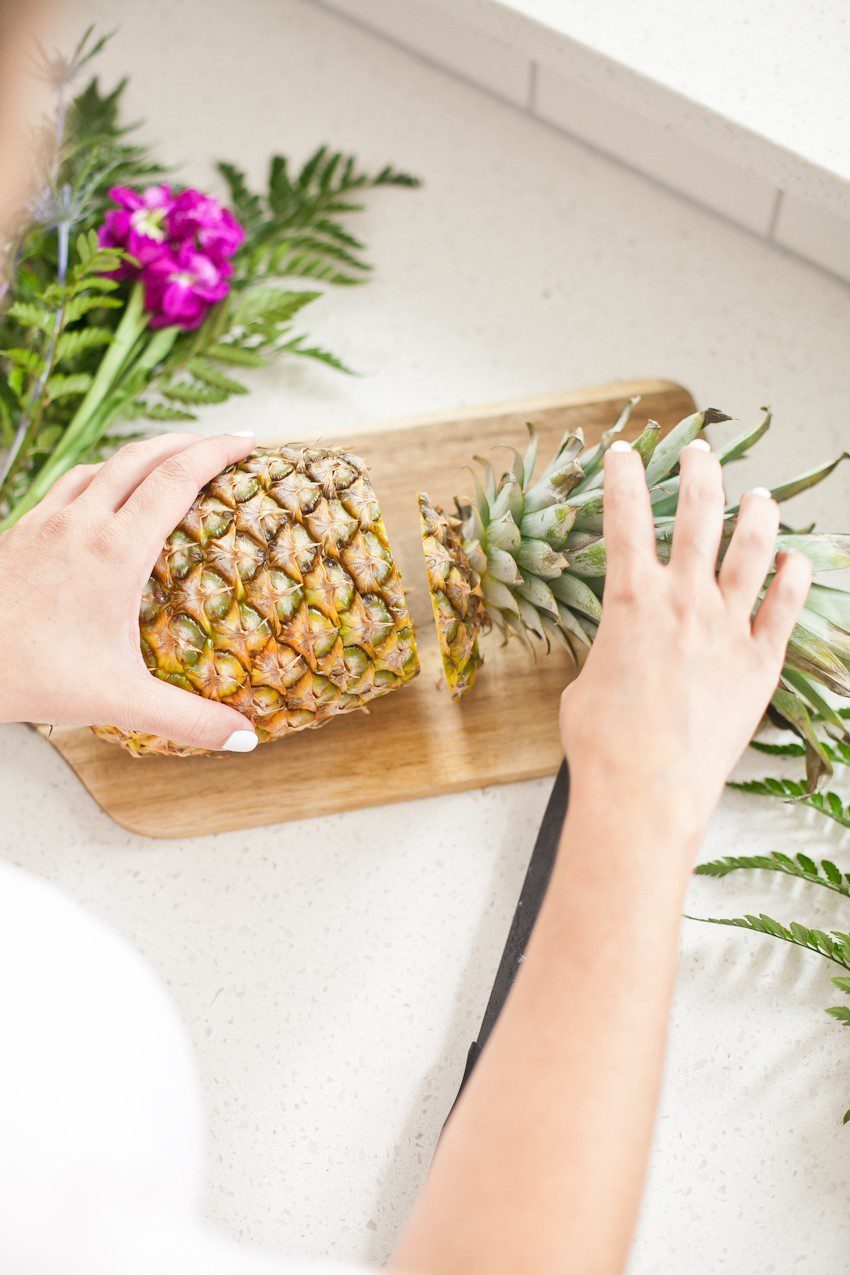 Pineapple Flower Arrangement for garden parties or a summer tropical fete! This DIY Pineapple vase is an easy to make centerpiece or perfect for a Tiki bar! - Tropical Pineapple Floral Arrangement featured by popular Florida lifestyle blogger Fresh Mommy Blog