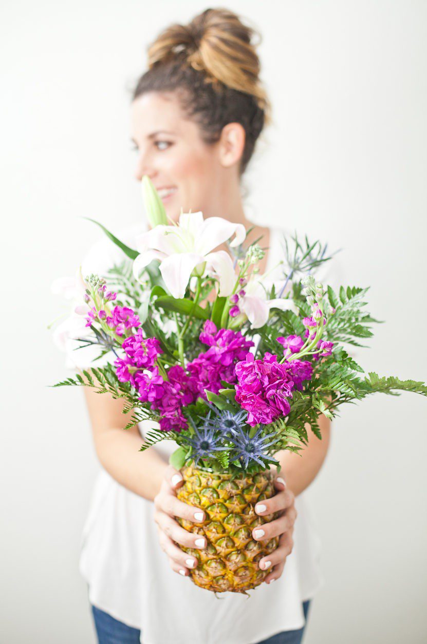 Pineapple Flower Arrangement for garden parties or a summer tropical fete! This DIY Pineapple vase is an easy to make centerpiece or perfect for a Tiki bar! - Tropical Pineapple Floral Arrangement featured by popular Florida lifestyle blogger Fresh Mommy Blog