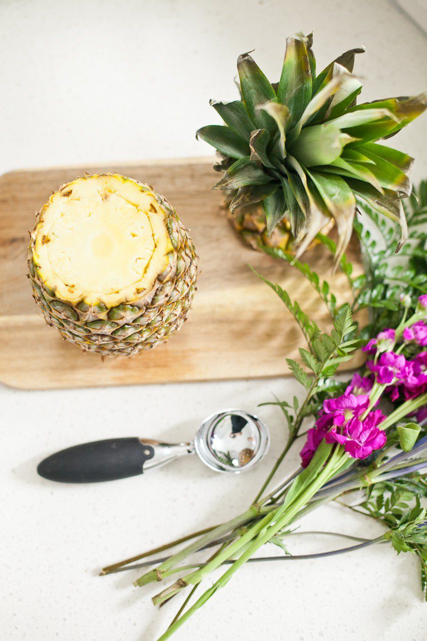 Pineapple Flower Arrangement for garden parties or a summer tropical fete! This DIY Pineapple vase is an easy to make centerpiece or perfect for a Tiki bar! - Tropical Pineapple Floral Arrangement featured by popular Florida lifestyle blogger Fresh Mommy Blog