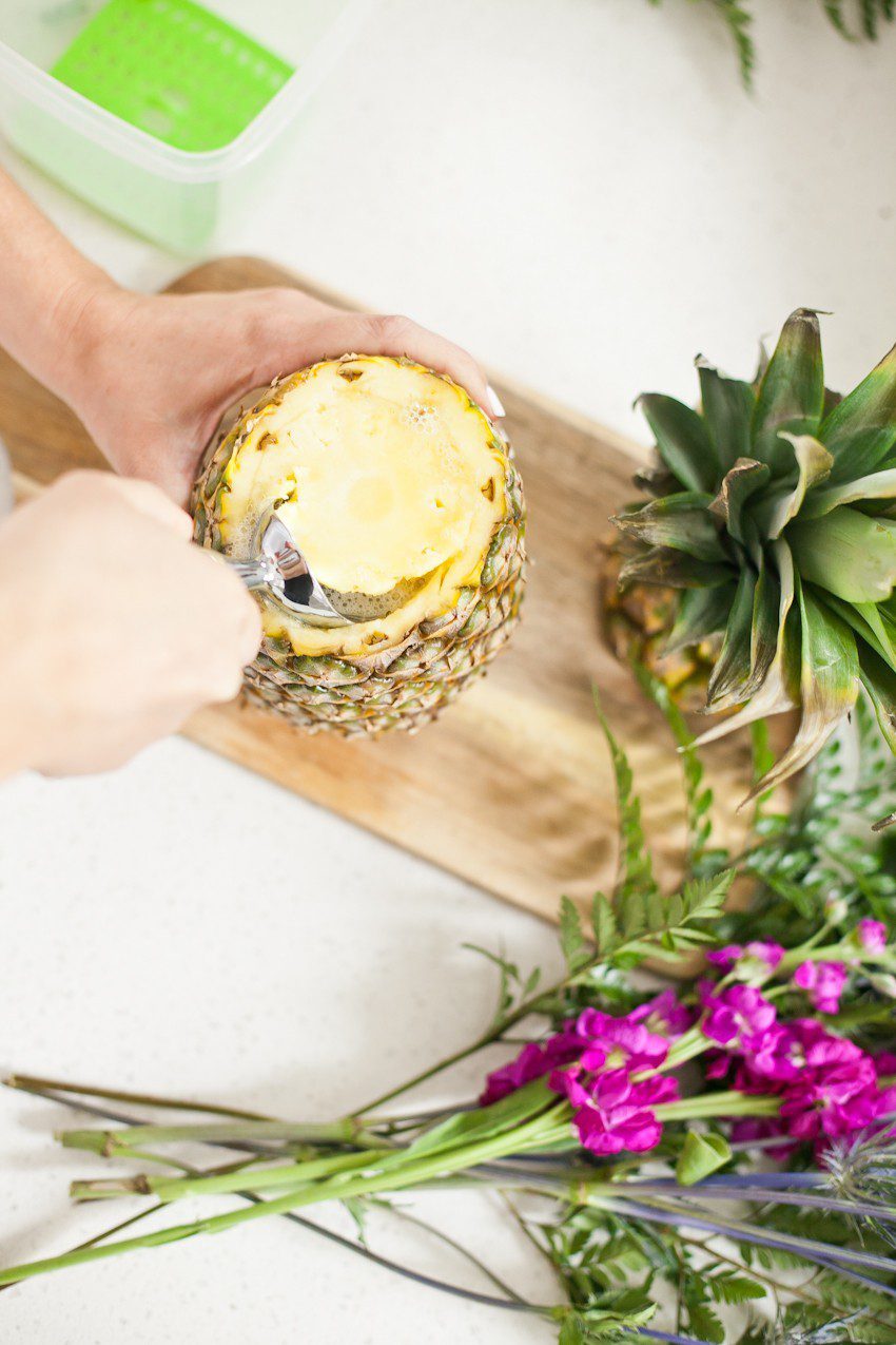 Pineapple Flower Arrangement for garden parties or a summer tropical fete! This DIY Pineapple vase is an easy to make centerpiece or perfect for a Tiki bar! - Tropical Pineapple Floral Arrangement featured by popular Florida lifestyle blogger Fresh Mommy Blog