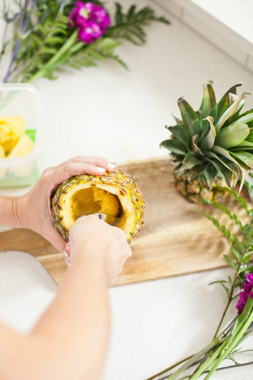 Pineapple Flower Arrangement for garden parties or a summer tropical fete! This DIY Pineapple vase is an easy to make centerpiece or perfect for a Tiki bar! - Tropical Pineapple Floral Arrangement featured by popular Florida lifestyle blogger Fresh Mommy Blog