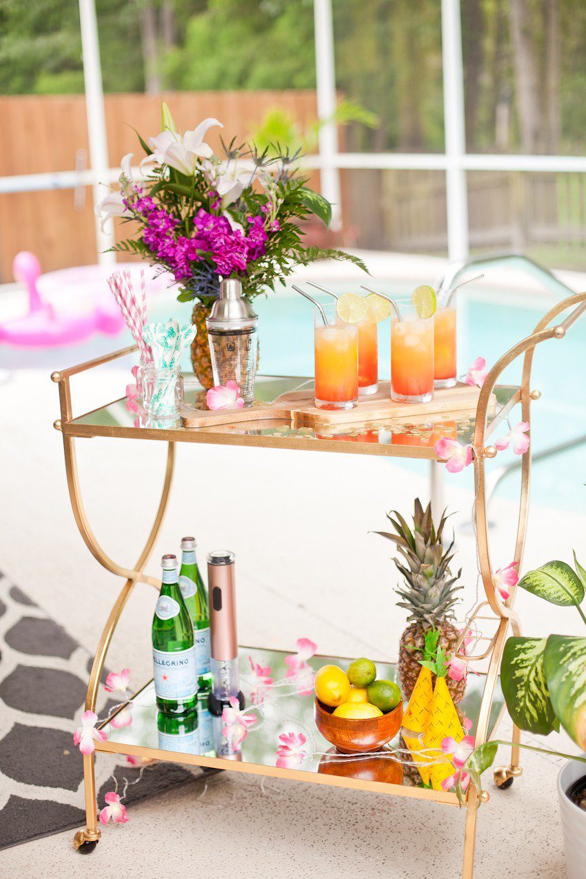 Pineapple Flower Arrangement for garden parties or a summer tropical fete! This DIY Pineapple vase is an easy to make centerpiece or perfect for a Tiki bar! - Tropical Pineapple Floral Arrangement featured by popular Florida lifestyle blogger Fresh Mommy Blog