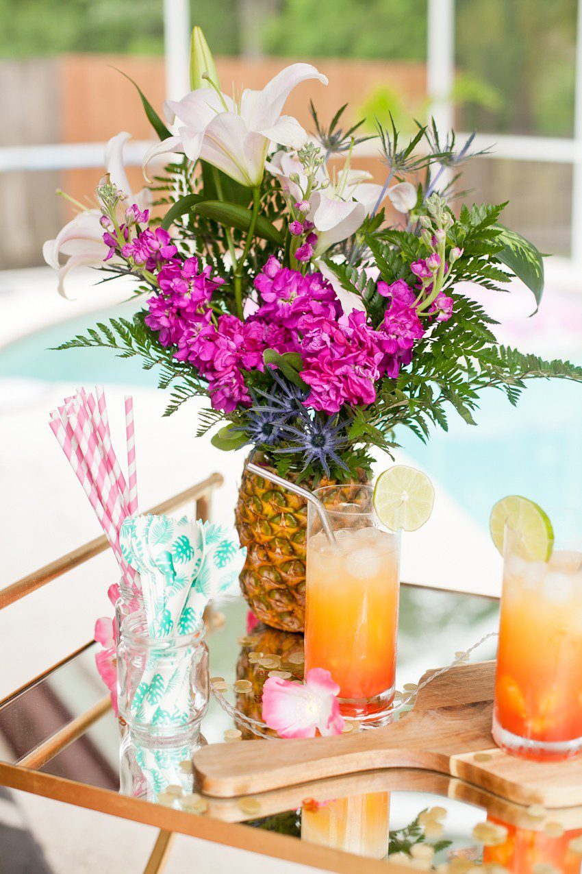 Pineapple Flower Arrangement for garden parties or a summer tropical fete! This DIY Pineapple vase is an easy to make centerpiece or perfect for a Tiki bar! - Tropical Pineapple Floral Arrangement featured by popular Florida lifestyle blogger Fresh Mommy Blog