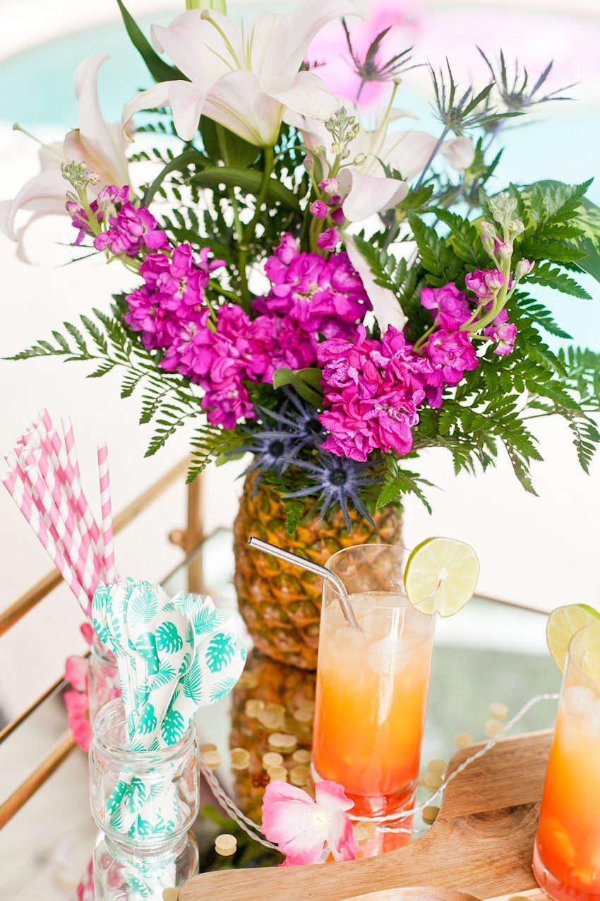 Pineapple Flower Arrangement for garden parties or a summer tropical fete! This DIY Pineapple vase is an easy to make centerpiece or perfect for a Tiki bar! - Tropical Pineapple Floral Arrangement featured by popular Florida lifestyle blogger Fresh Mommy Blog