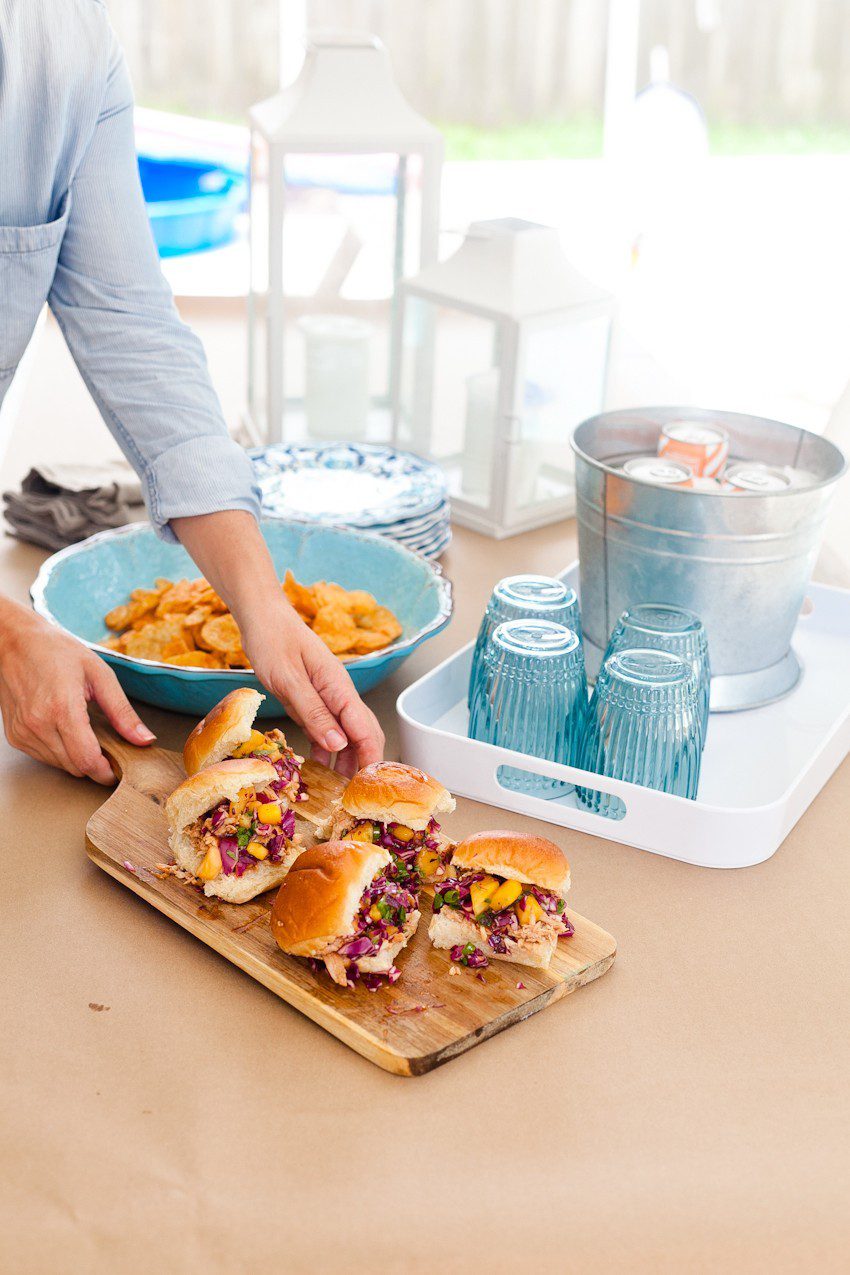 Easy Entertaining and BBQ Hawaiian Chicken Sliders recipe with pineapple mango slaw. Great summer backyard barbecue ideas featured by popular Florida foodie blogger and lifestyle blogger Tabitha Blue of Fresh Mommy Blog Easy Entertaining and BBQ Hawaiian Chicken Sliders recipe with pineapple mango slaw. Great summer backyard barbecue ideas featured by popular Florida foodie blogger and lifestyle blogger Tabitha Blue of Fresh Mommy Blog