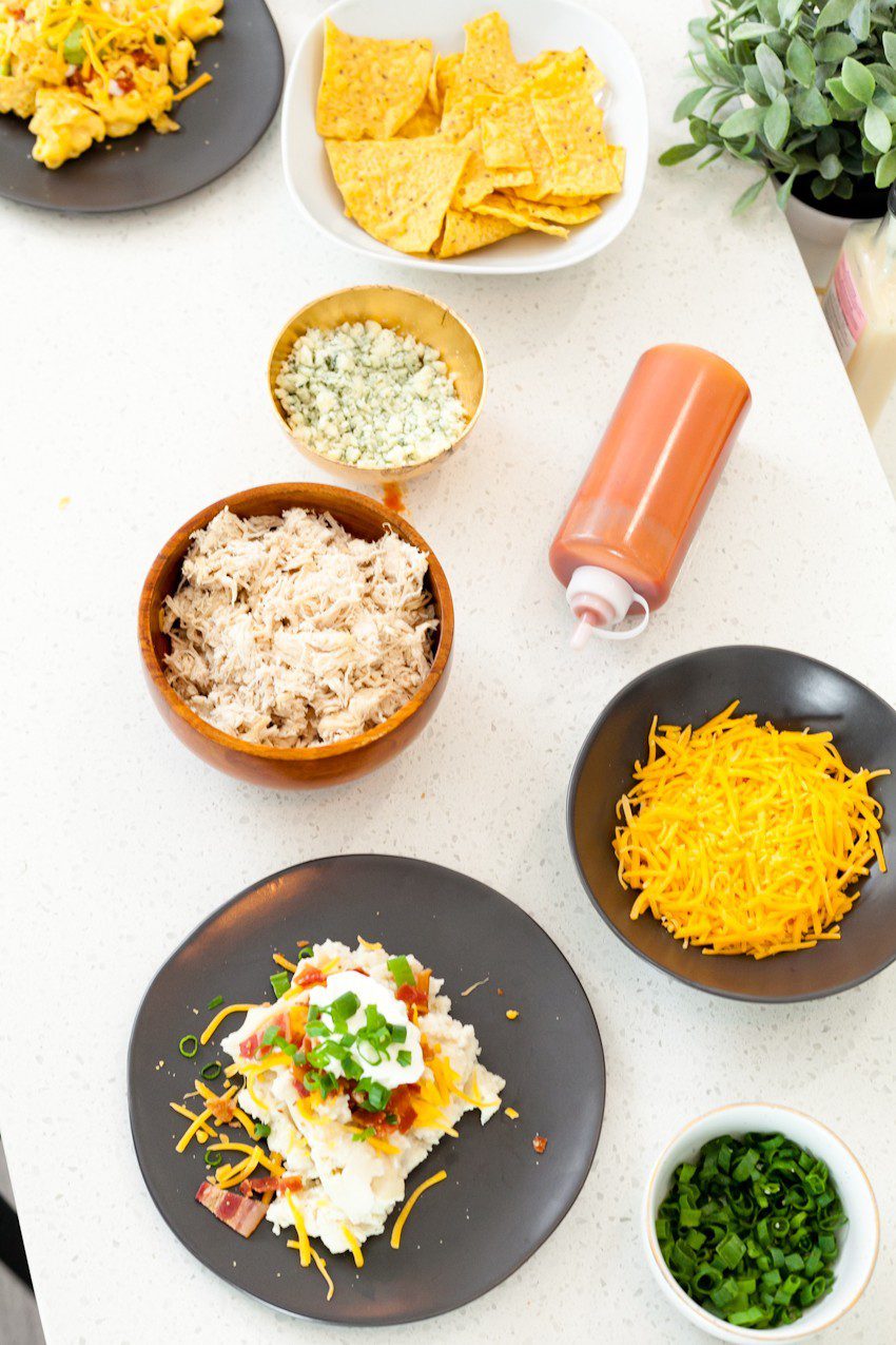 Between the last few lazy weekends of football we have left and the holiday season upon us, we've no shortage of entertaining at our doorstep. Welcome guests with open arms once you set up with a simple Mashed Potato and Mac and Cheese Bar that will rival any game on the big screen!