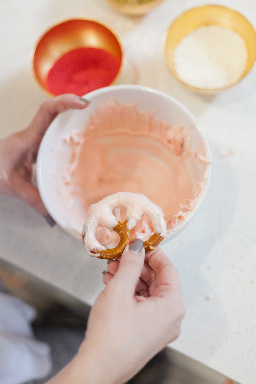 A simple and easy Valentine's Day chocolate dipped pretzels treat, that you can make with and for your kids (they look like they took more effort than they really do!), by Tabitha Blue of Fresh Mommy Blog - Valentines Day Lovely Chocolate Dipped Pretzels by popular Florida lifestyle blogger Fresh Mommy Blog