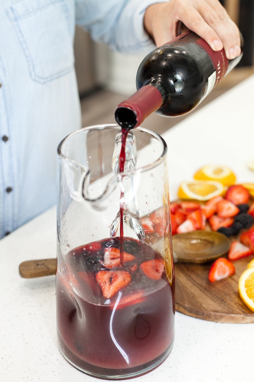 What better way to celebrate the season than with a blood orange berry summer sangria? It's our go-to summer drink and with one big hack to make sangria even easier, this recipe is perfect for your next gathering or summer get together! - Refreshing Blood Orange Berry Summer Sangria Recipe featured by popular Florida lifestyle blogger, Tabitha Blue of Fresh Mommy Blog