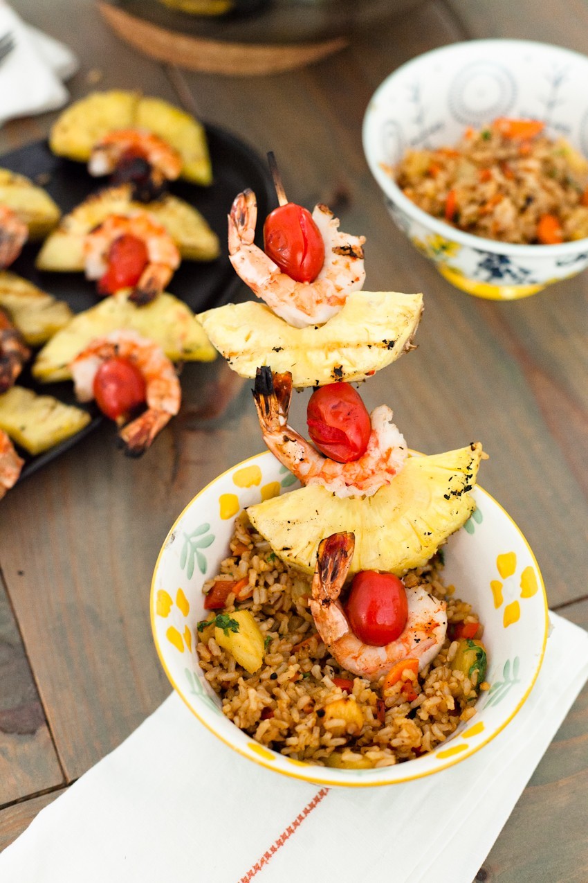 shrimp and pineapple skewers with pineapple fried rice | Grilling Season by popular Florida lifestyle blog, Fresh Mommy Blog: image of shrimp kabobs with cherry tomatoes and pineapple slices.