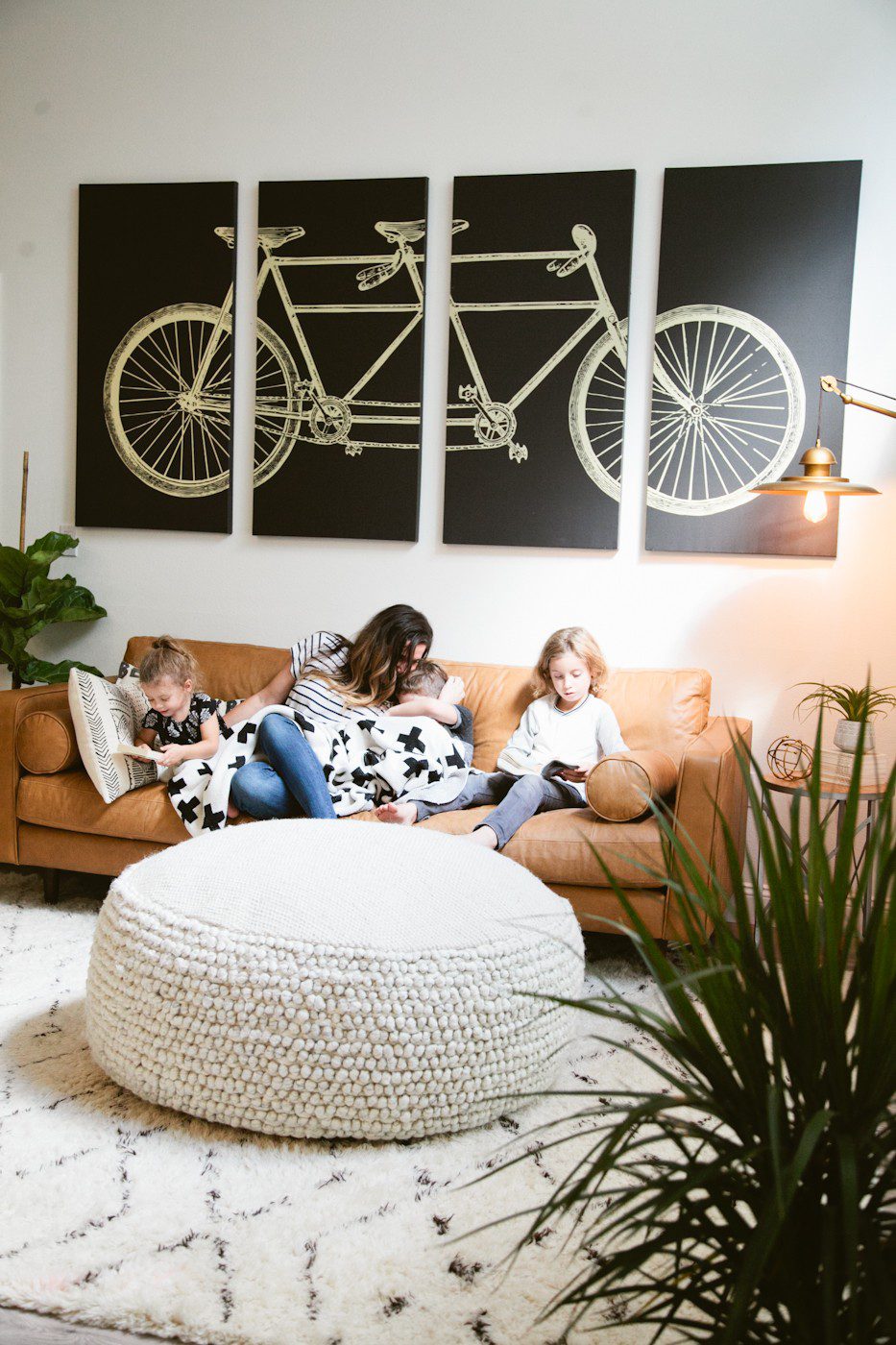 Seeing past dated paint colors, a wall of mirrors, popcorn ceiling and mismatched flooring, this ultimate living room has been completely transformed to a cozy and comfortable open family living space with bold statement pieces like our Article sofa, neutral colors and touches of sleek mid century and Scandinavian inspired design. The ultimate living room makeover before and after for a busy family from popular Florida lifestyle blogger Tabitha Blue of Fresh Mommy Blog. | Article sofa featured in the latest living room makeover by top Florida lifestyle blog, Fresh Mommy Blog