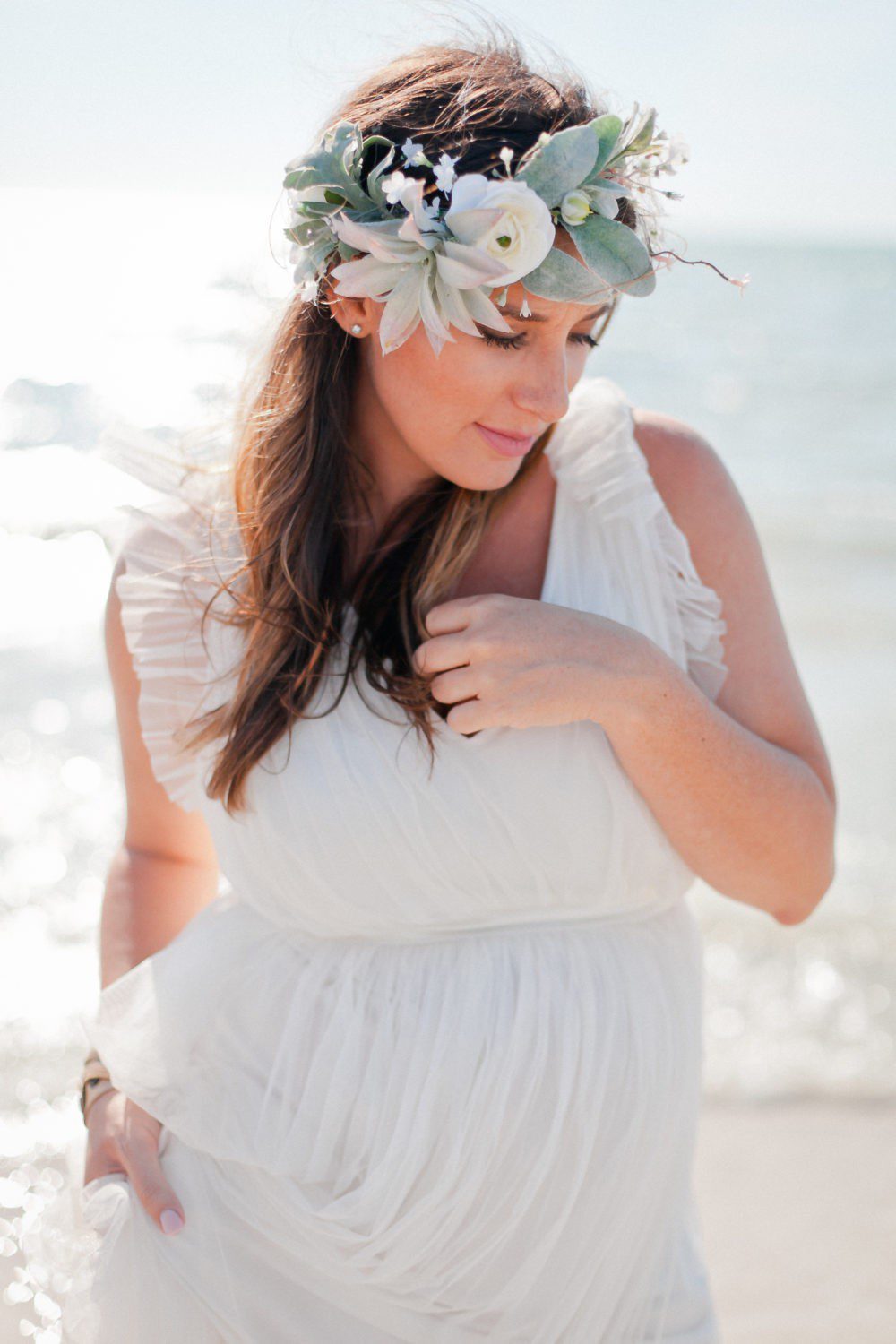15 Years of Marriage featured by top US lifestyle blog Fresh Mommy Blog; Image of a woman wearing a white dress on the beach.
