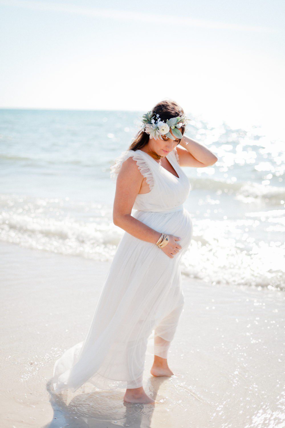 15 Years of Marriage featured by top US lifestyle blog Fresh Mommy Blog; Image of a woman wearing a white dress on the beach