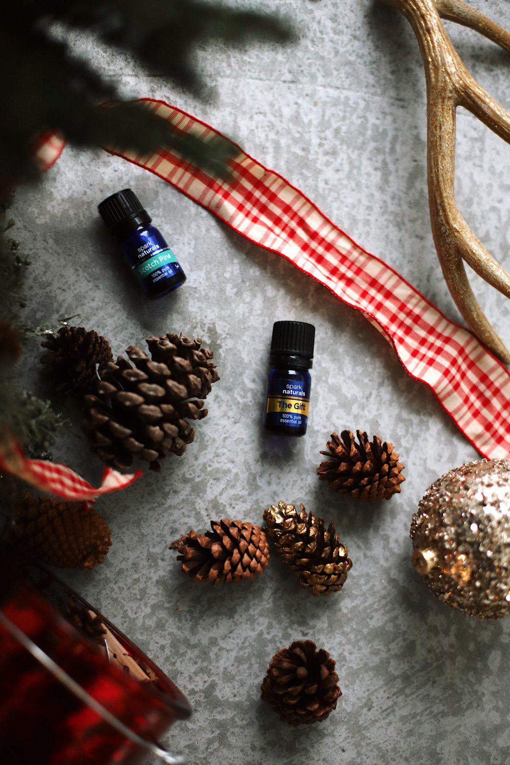 12 Days of Christmas Essential Oils | 12 Christmas Essential Oils to Fight Stress by popular Florida life and style blog, Fresh Mommy: image of Spark Naturals Scotch Pine and The Gift essential oils. 