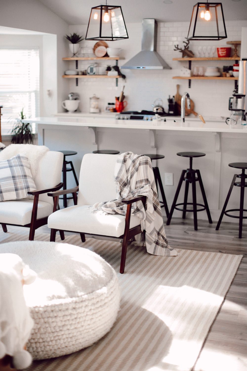 7 Geniously Efficient Mom Hacks for Home Design | 7 Genius Efficient Home Design Hacks for Moms by popular Florida life and style blog, Fresh Mommy Blog: image of a neutral colored kitchen and living room with furniture from CORT furniture outlet.