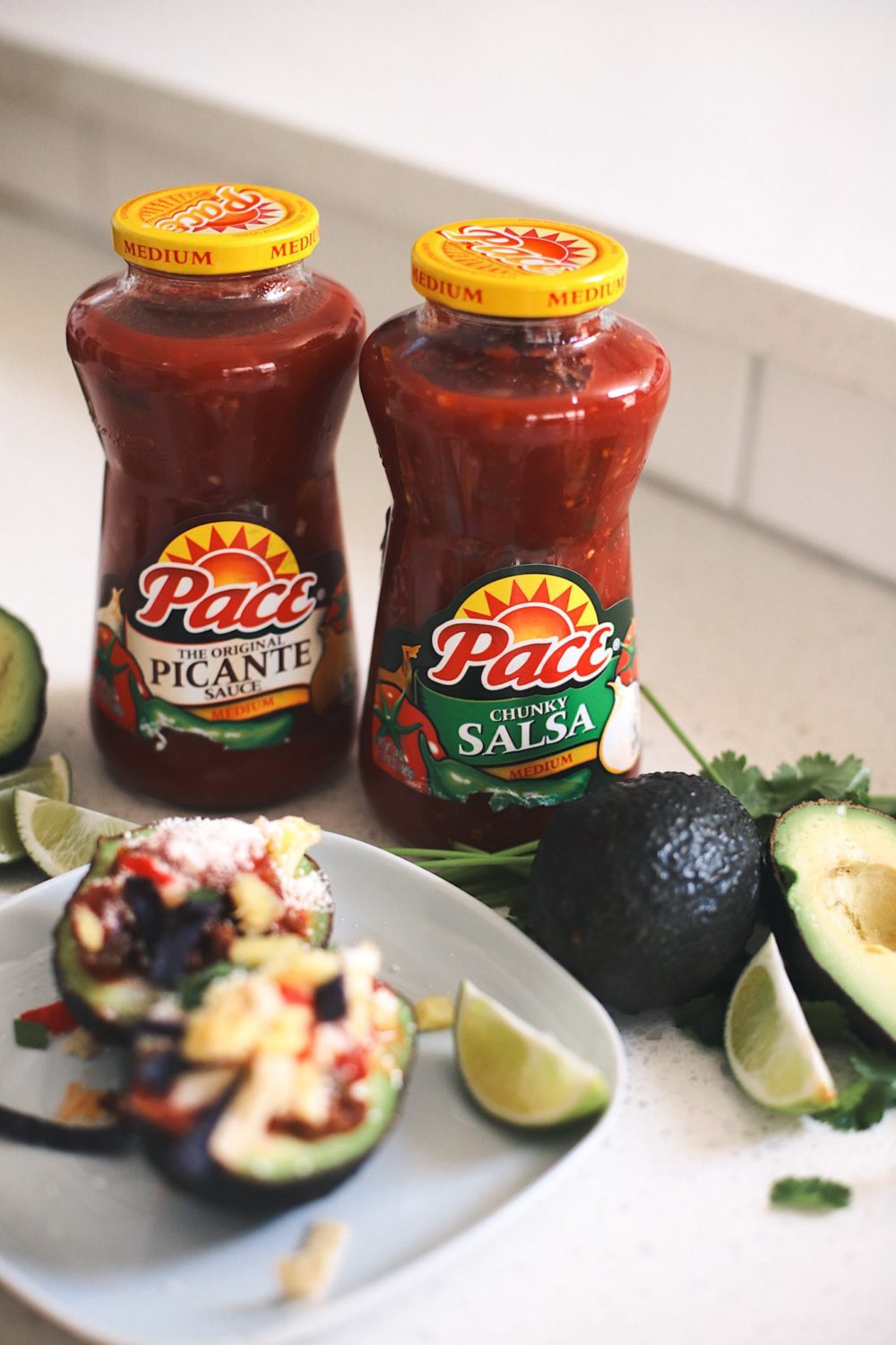 Avocado Keto Taco Bowls recipe featured by top Florida lifestyle blog, Fresh Mommy Blog: Pace Picante Sauce and Pace Chunky Salsa | Keto Taco Bowls by popular Florida lifestyle blog, Fresh Mommy Blog: image of Pace salsa jars and avocado keto taco bowls.