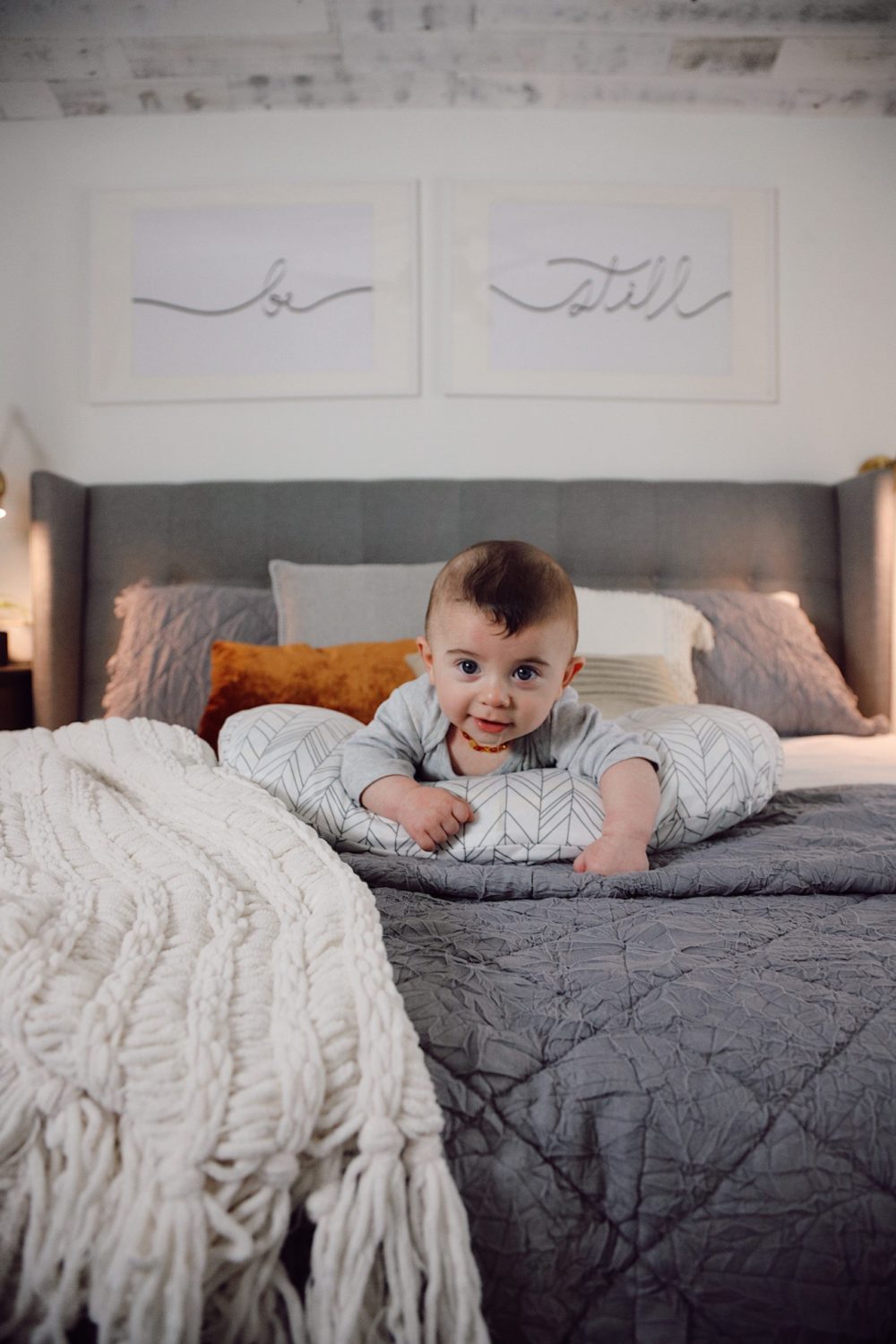 how to Make your Bed Comfortable Like a Hotel in 7 Easy Steps, a tutorial featured by top Florida lifestyle blog, Fresh Mommy Blog. Cutest baby on the cosiest bed. Lennon Blue | Best Bedding by popular Florida life and style blog, Fresh Mommy: image of a comfortable bed with a baby laying on it's stomach on top of it. 