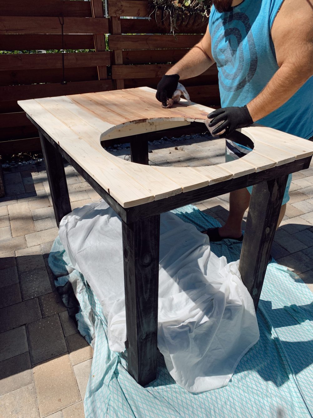 Outdoor Grill Table DIY and Plans for How To Build a Mobile Grill Cart | DIY BBQ Table by popular Florida lifestyle blog, Fresh Mommy Blog: image of a man making a DIY BBQ table.