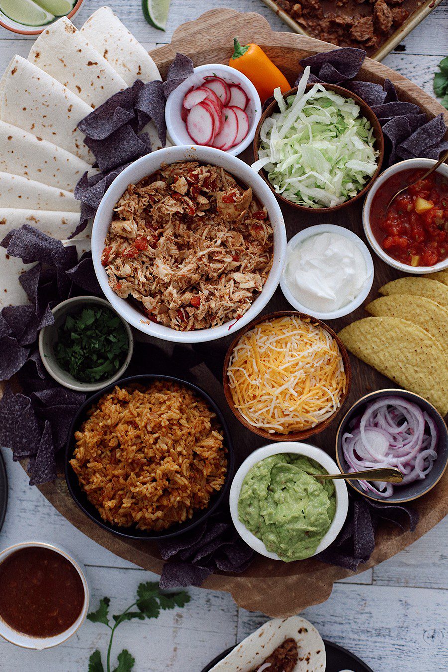 How to make an epic taco board and taco party platter tips! Plus, the best slow cooker taco chicken recipe! | Chicken Tacos by popular Florida lifestyle blog, Fresh Mommy Blog: image of a Chicken Tacos platter. 