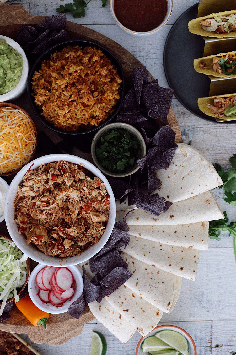 How to make an epic taco board and taco party platter tips! Plus, the best slow cooker taco chicken recipe! | Chicken Tacos by popular Florida lifestyle blog, Fresh Mommy Blog: image of a Chicken Tacos platter. 