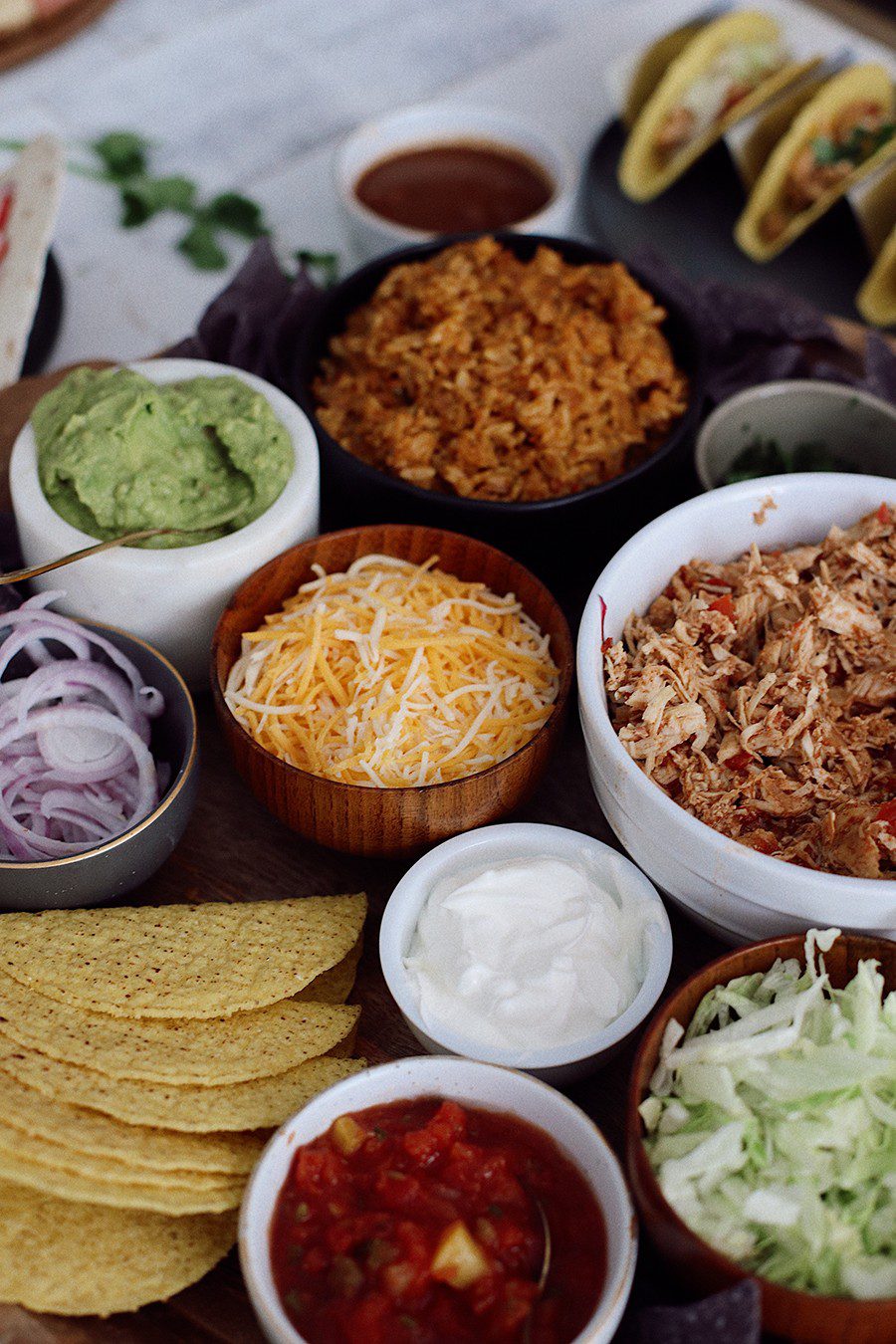 How to make an epic taco board and taco party platter tips! Plus, the best slow cooker taco chicken recipe! | Chicken Tacos by popular Florida lifestyle blog, Fresh Mommy Blog: image of a chicken tacos platter. 